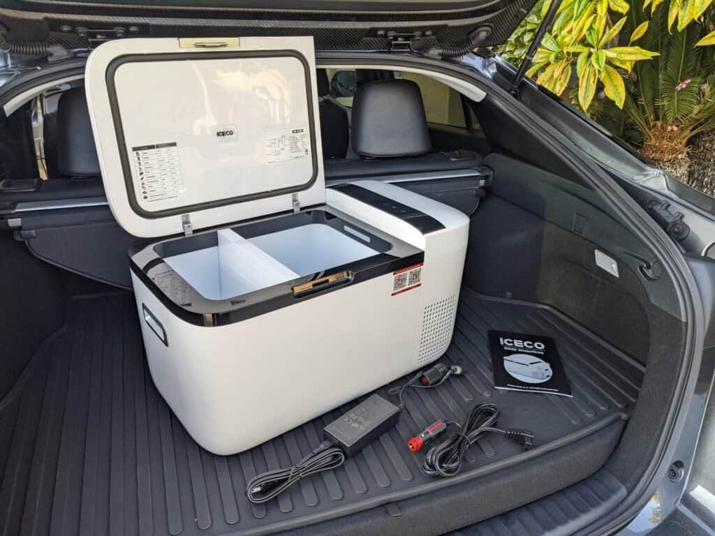 Portable car refrigerator for vehicle travel, compact and energy-efficient.