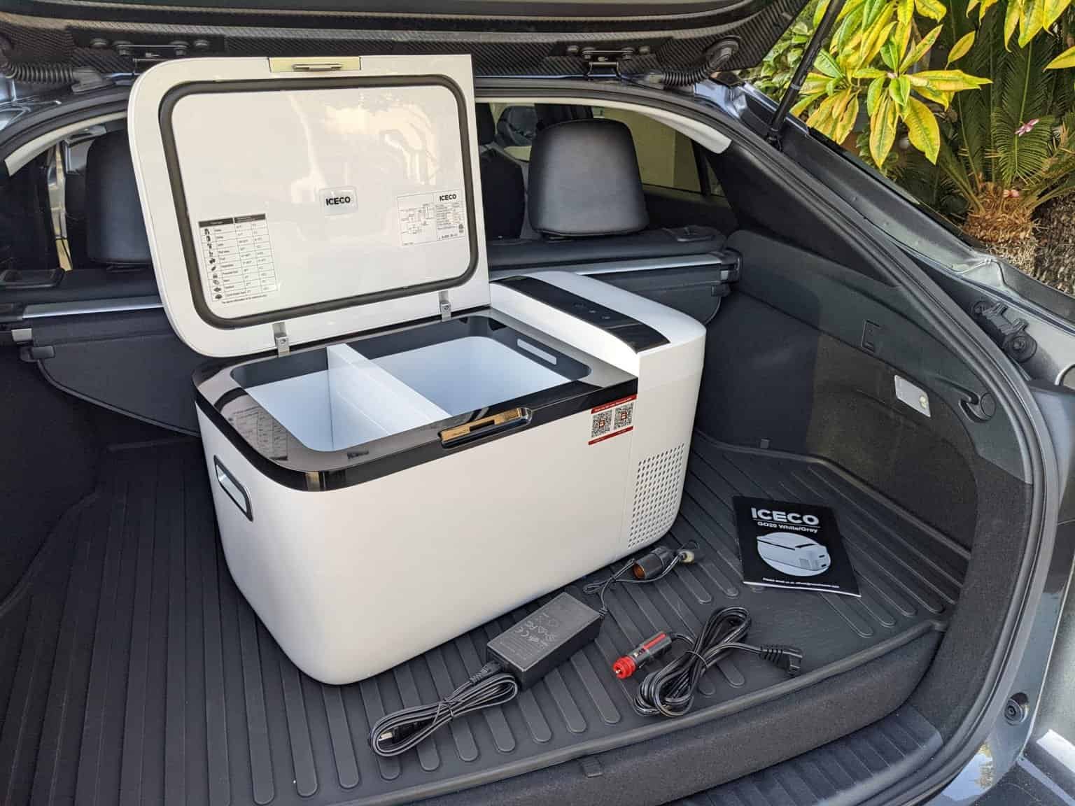 Portable car refrigerator for vehicle travel, compact and energy-efficient.