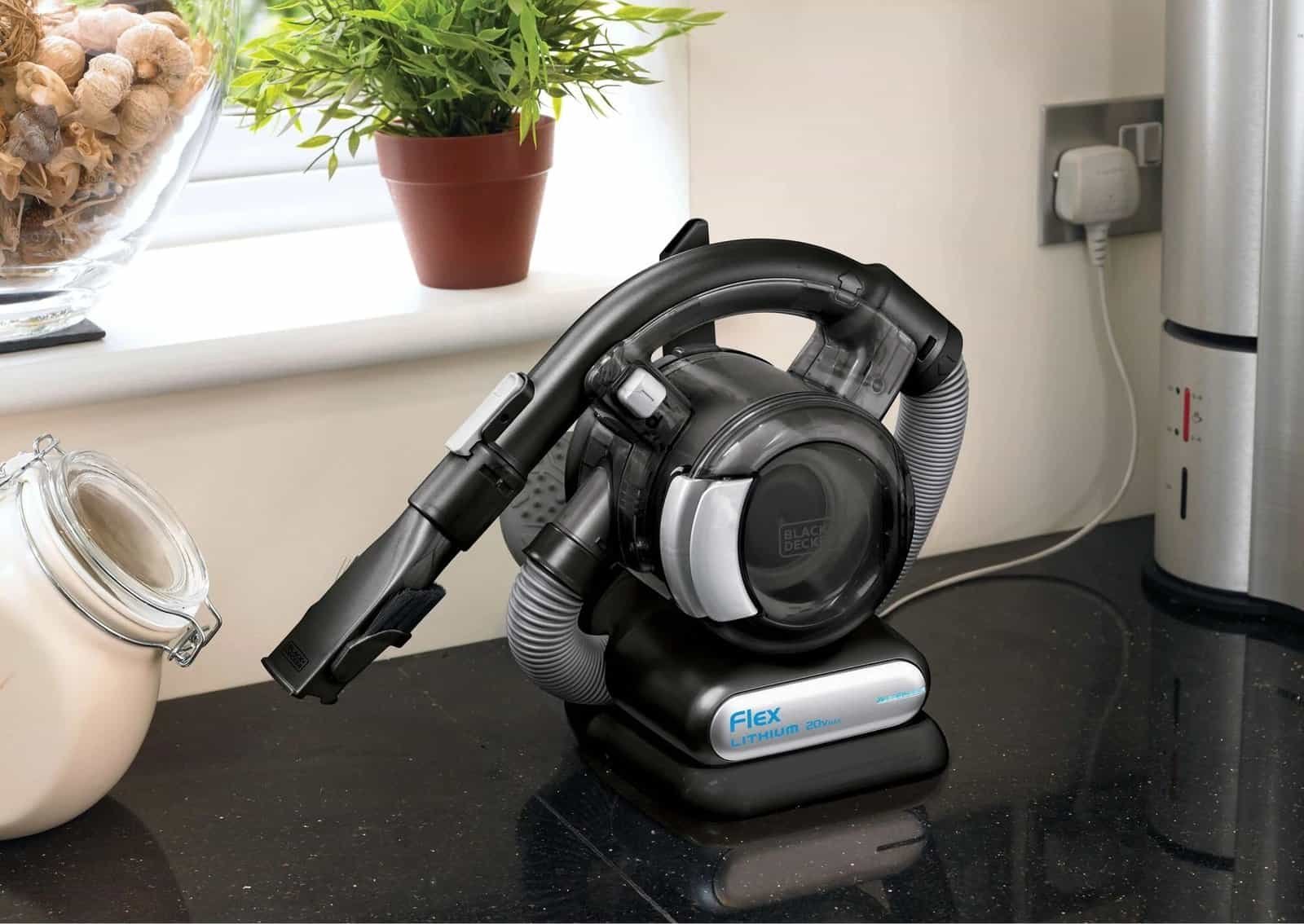 Vacuum cleaner with car accessory for efficient cleaning.