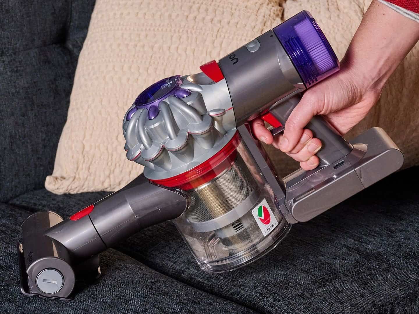 Lightweight cordless handheld vacuum cleaner for car upholstery cleaning.