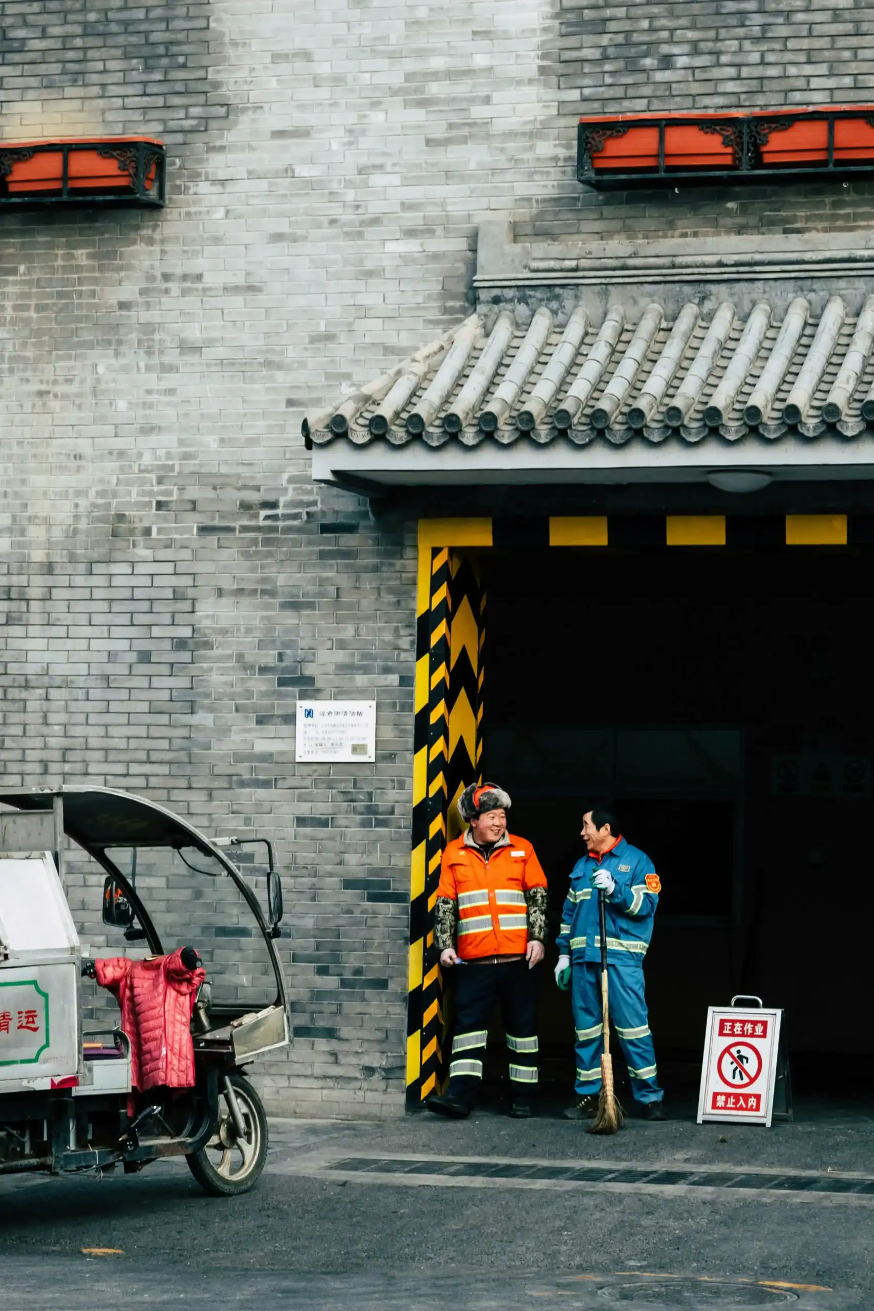 Emergency vehicle personnel at garage entrance.