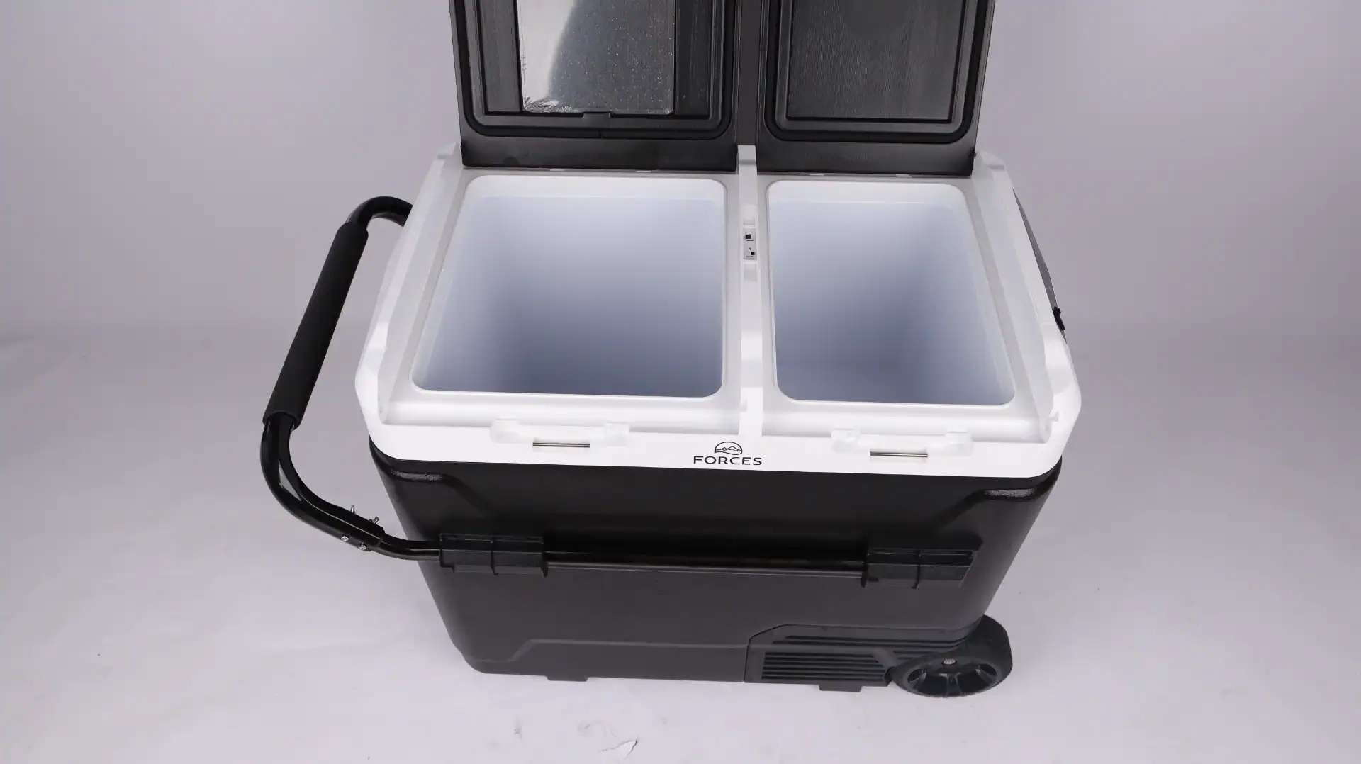 Black and white dual-compartment portable car fridge with a handle, open lids, and visible wheels, ideal for travel and outdoor use.