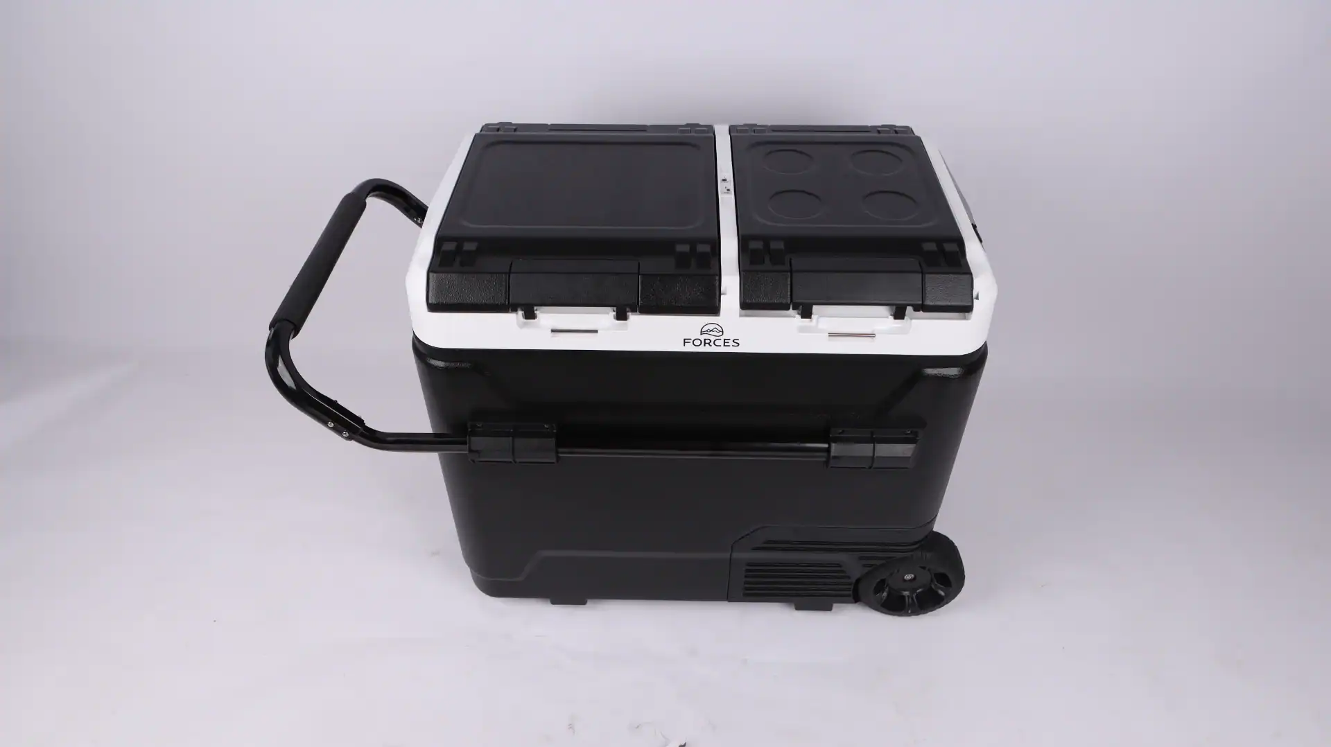 Black and white portable car fridge with wheels and a sturdy pull handle, designed for outdoor and vehicle use.