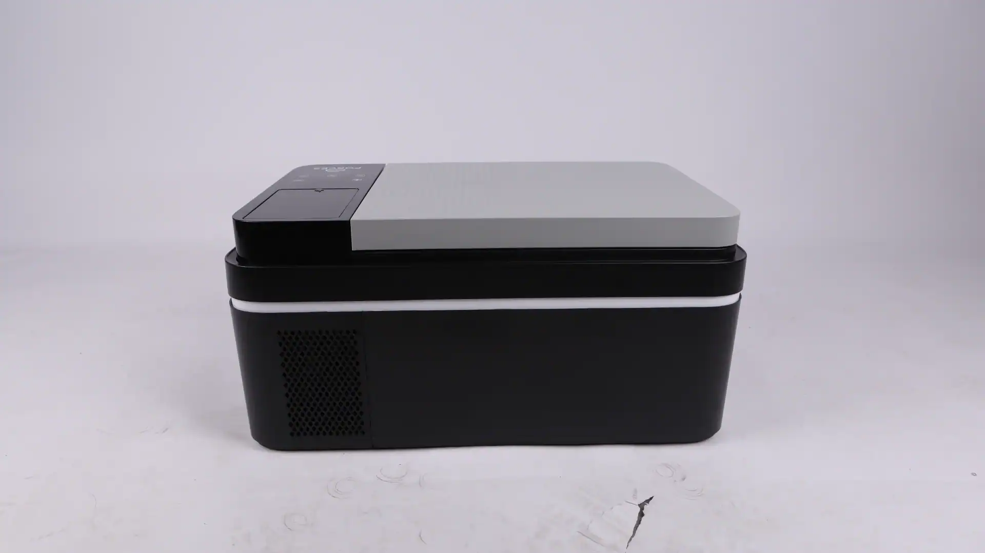 Portable car mini fridge in a black and gray design resting on a white surface, featuring a compact and modern design.