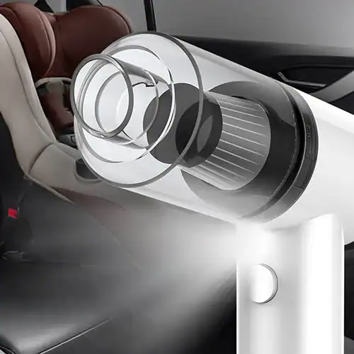 Portable car vacuum cleaner with sleek design and visible filter structure placed inside a car interior.