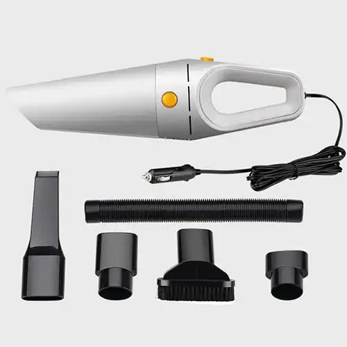 Compact portable car vacuum cleaner with white and orange accents, shown with its accessories including a crevice tool, hose, and brush attachments on a gray background.