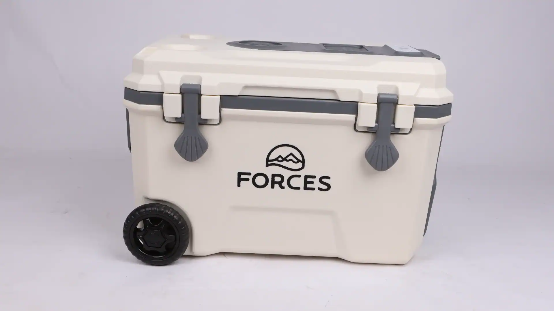 Beige portable car cooler with wheels, secure latches, and 'Forces' branding on the front, ideal for outdoor and travel use.